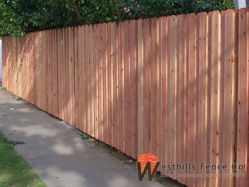 Dogear board on board redwood fence